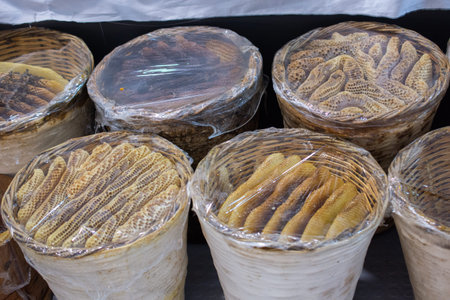 Honey in honeycomb from round beehive with sweet honey
