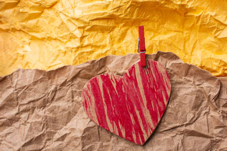 Red heart icon  on wrinkled paper for love  and valentine conceptの写真素材
