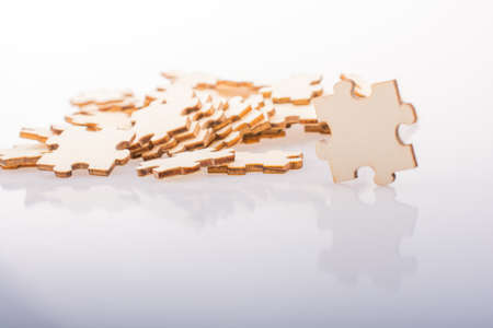 Pieces of jigsaw puzzle as problem solution concept on white backgroundの写真素材