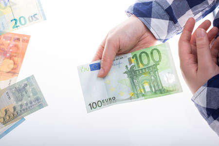 Hands holding euro banknotes currencies as  financial activityの写真素材