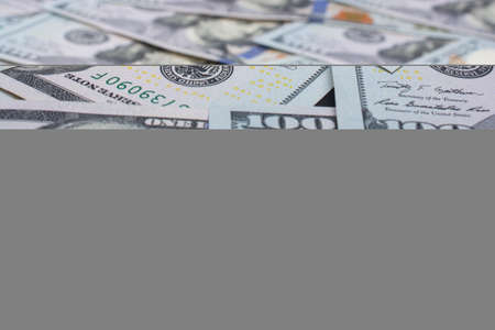 One Hundred Dollar American Banknotes and man figurine