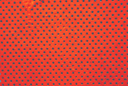 Detailed texture background gray sheet metal perforated. Steel plate with holes