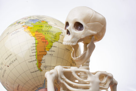 the earth in a skeleton hand