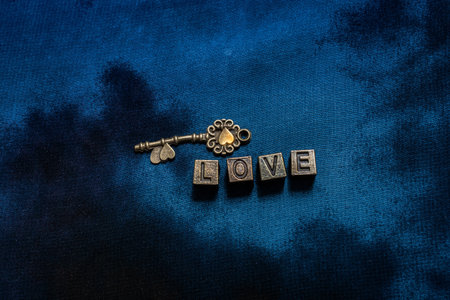 Ornamental keys around the Love wording with retro metal letters