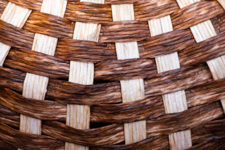 The texture of straw, weaving from straws backgroundの写真素材