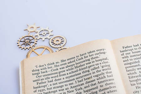 The concept of business gear wheels placed on book pageの写真素材