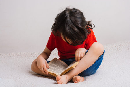 Little boy with book in hand  as education studying concept