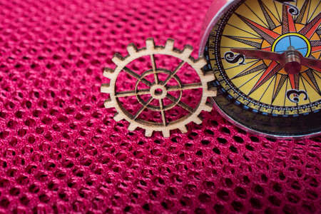 Gear wheel and a compass as The concept of mechanismの写真素材