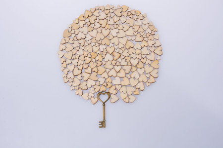 Retro  style heart shaped key on wooden hearts