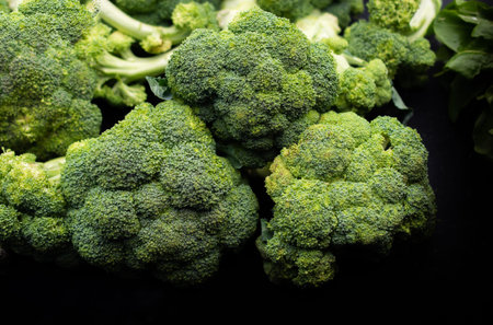 Fresh Broccoli in a pile at supermarket. Fresh and ripe broccoli background.
