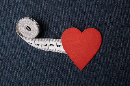 Measuring tape to symbolize an healthy diet and body weight controlの写真素材