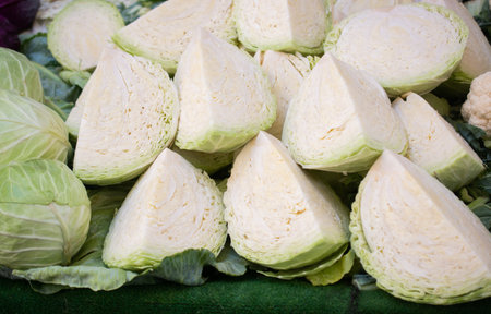 Cabbages in pieces at  rmarket, Cabbage background, Fresh cabbage from farm fieldの写真素材