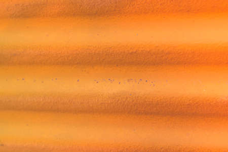 Weathered and distressed painted corrugated metal backgroundの写真素材