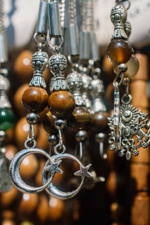 Colorful beads of various color and crescentの写真素材