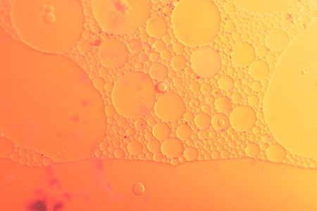 Oil bubbles inside water base form patternsの写真素材