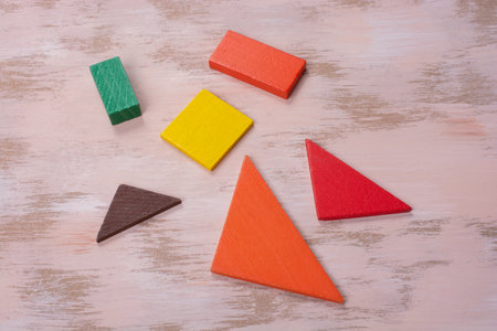 Concept of creative logical thinking. Different colorful wooden blocks. Geometric shapes in different colors.の写真素材