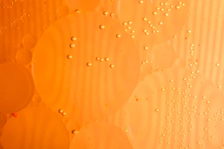 Oil bubbles inside water base form patternsの写真素材