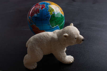 Polar bear model and a globe model in viewの写真素材