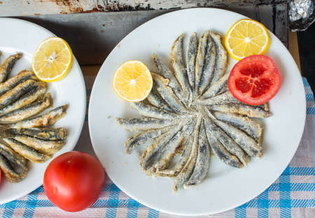 Tray with ready to fry anchovies fish fish as seafoodの写真素材
