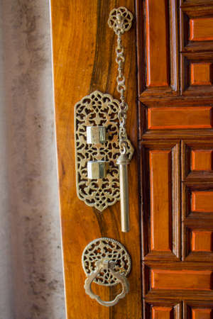 Old Handmade ottoman door knob on woodの写真素材