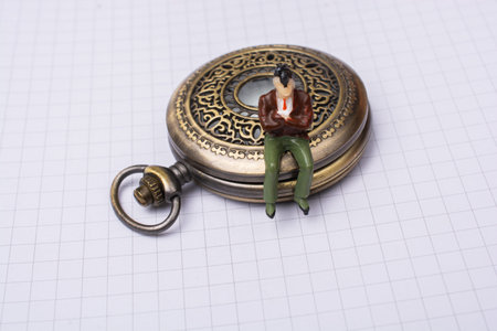 Mechanical retro pocket watch  and a man figurine