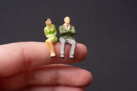 Tiny figurine of man  and woman miniature model in viewの写真素材
