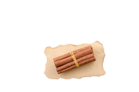 Cinnamon sticks isolated on white background. Dry tree bark.