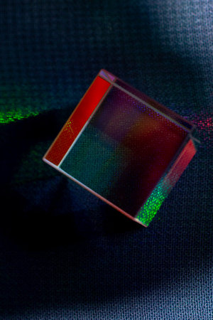 Luminous prism cubes refract light in different colors.