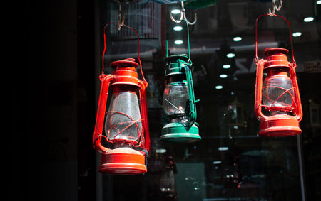 Old retro  style lantern made of metal in hand