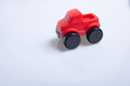 Red toy truck lorry on white backgroundの写真素材