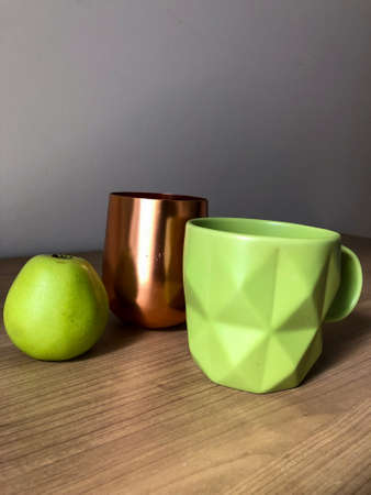 Green cup and green appleの写真素材