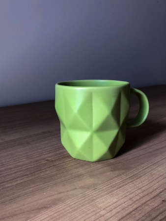 Green cup and green appleの写真素材