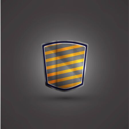 Glossy black and yellow shield emblem on black backgroundの写真素材