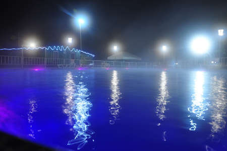 Empty swimming pool at nightの写真素材