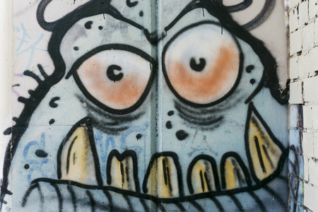 Cartoonish graffiti at wall in Berlin, Germanyのeditorial素材