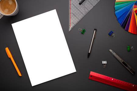 Empty or blank page in top view on creative desk or workplace as mockup or template showing creativity in school or at workの写真素材