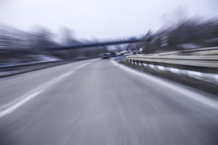 fast cars on a highway in winter (blurred)