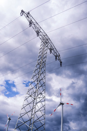 electrical tower and wind generator and storm clouds (alternative energy)