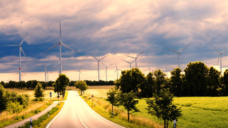 wind generators in landscape and cloudy sky