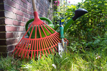 shovel, watering can, rake
