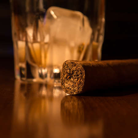 whiskey and cigar on wood tableの写真素材
