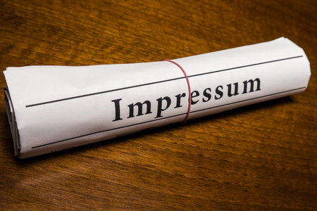 impressum newspaper (german) on desk
