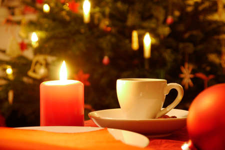 cup of coffe and candle at christmasの写真素材