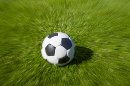 football in action on fieldの写真素材