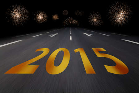 2015 written on asphalt with fireworksの写真素材