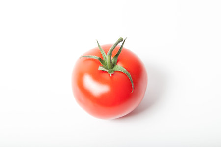 single tomato on white background