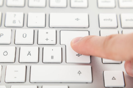 finger on enter button on keyboard