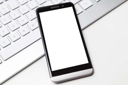 smartphone whith whitespace on deskの写真素材