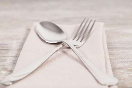 spoon and fork on a napkinの写真素材
