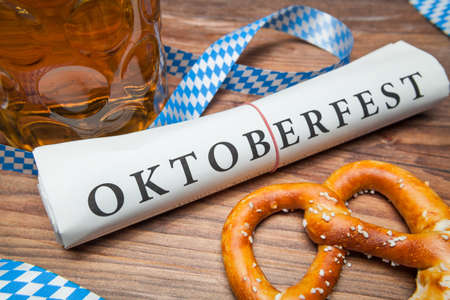 oktoberfest newspaper and pretzel with beerの写真素材